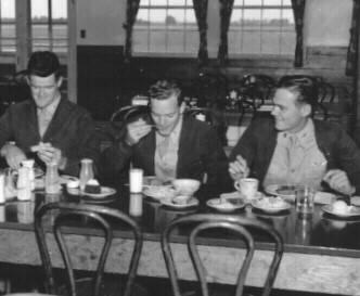 445th Bomb Group servicemen enjoying a meal.