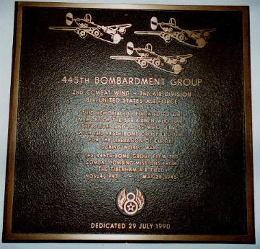 The bronze plaque commemorating the 445th Bomb Group, which is opposite the main entrance to Tibenham church.