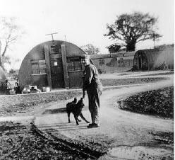 A serviceman and canine companion at the Shipdham air base.