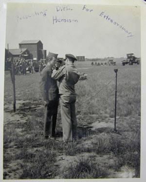 Col Pierce presenting a Distinguished Flying Cross medal to Sgt Thomas. From the collection of Wayne Tabor (MC 371/456 720x9) at Norfolk Record Office.