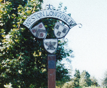 The village sign at Weston Longville, which commemorates the men who lost their lives serving with the 466th Bomb Group.