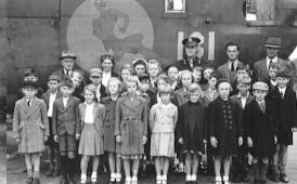 Pupils and teachers from West Lynn Primary School during a visit to the Wendling air base in May-June 1944.